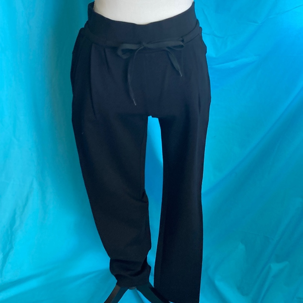 Black super stretchy knit , narrow leg pants.
